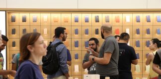 UAE residents queue through the night for iPhone 7 Customers shop at the Apple store in Dubai during the launch of the iPhone 7 at Mall of the Emirates. Pawan Singh / The National