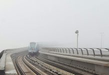 Photo: Dubai Metro emerging out of a thick blanket of fog that covered the city on Thursday morning.