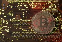 Bitcoin surges above $12,000 to record high